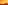A breathtaking view of yellow-tinted mountains and peaks illuminated by warm sunlight during a serene sunrise or sunset.