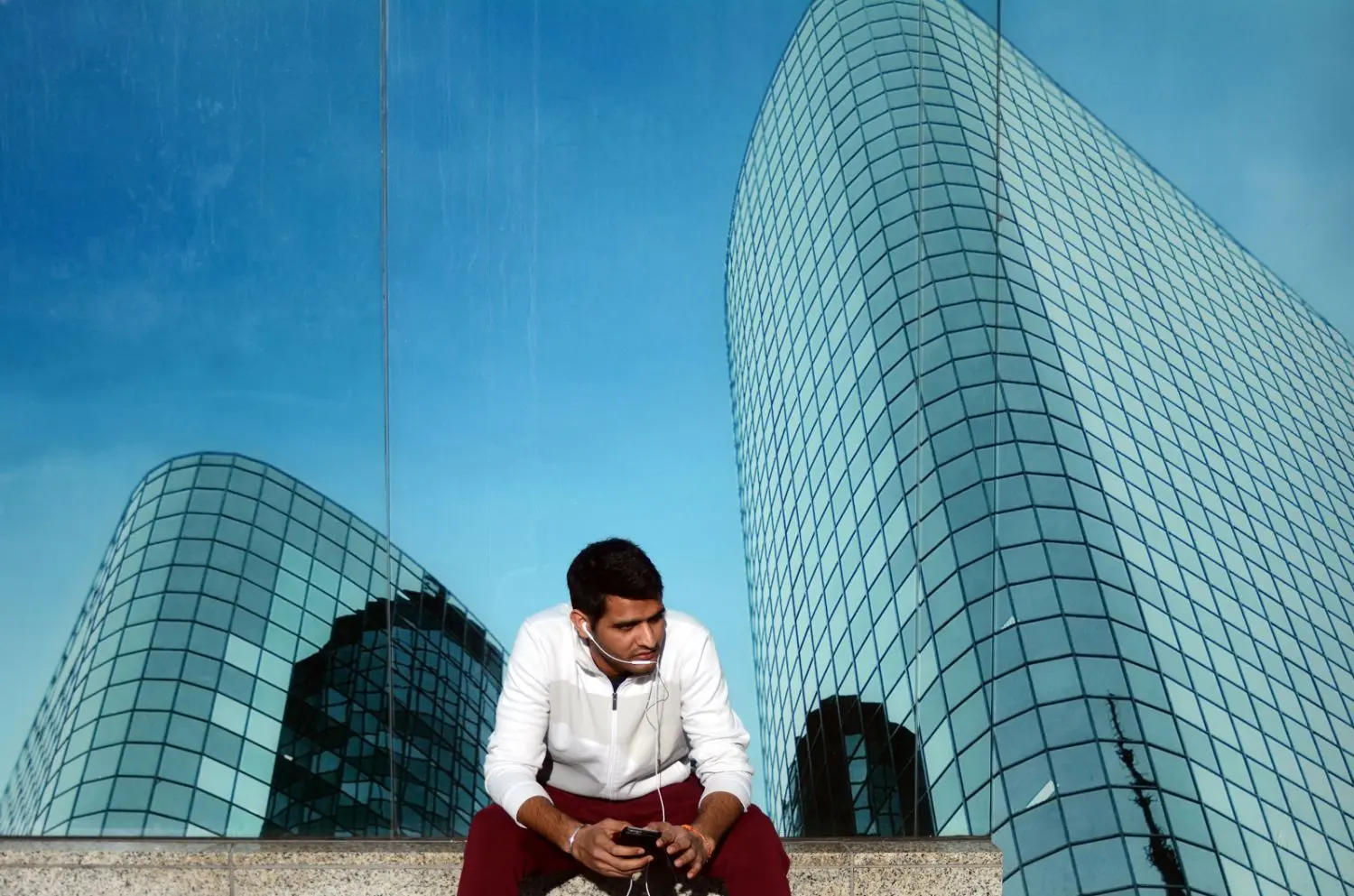 Image of a modern city in India and a business man