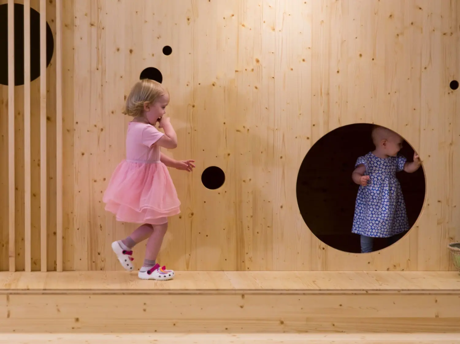 This a picture of the girls playing in Kids House opened at Swiss Re.