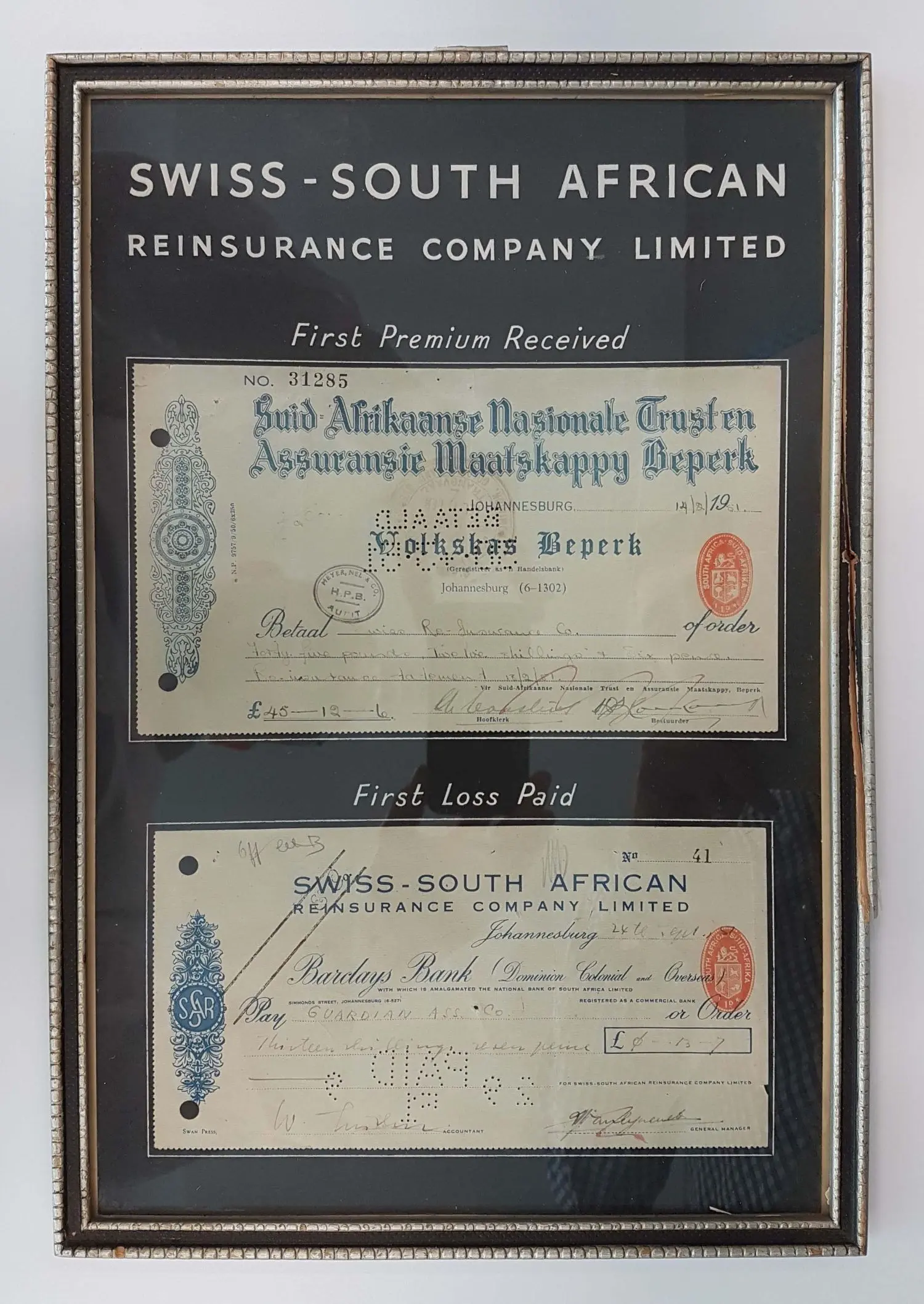 Framed Original cheques first premium received and first loss paid SSA CORYS.