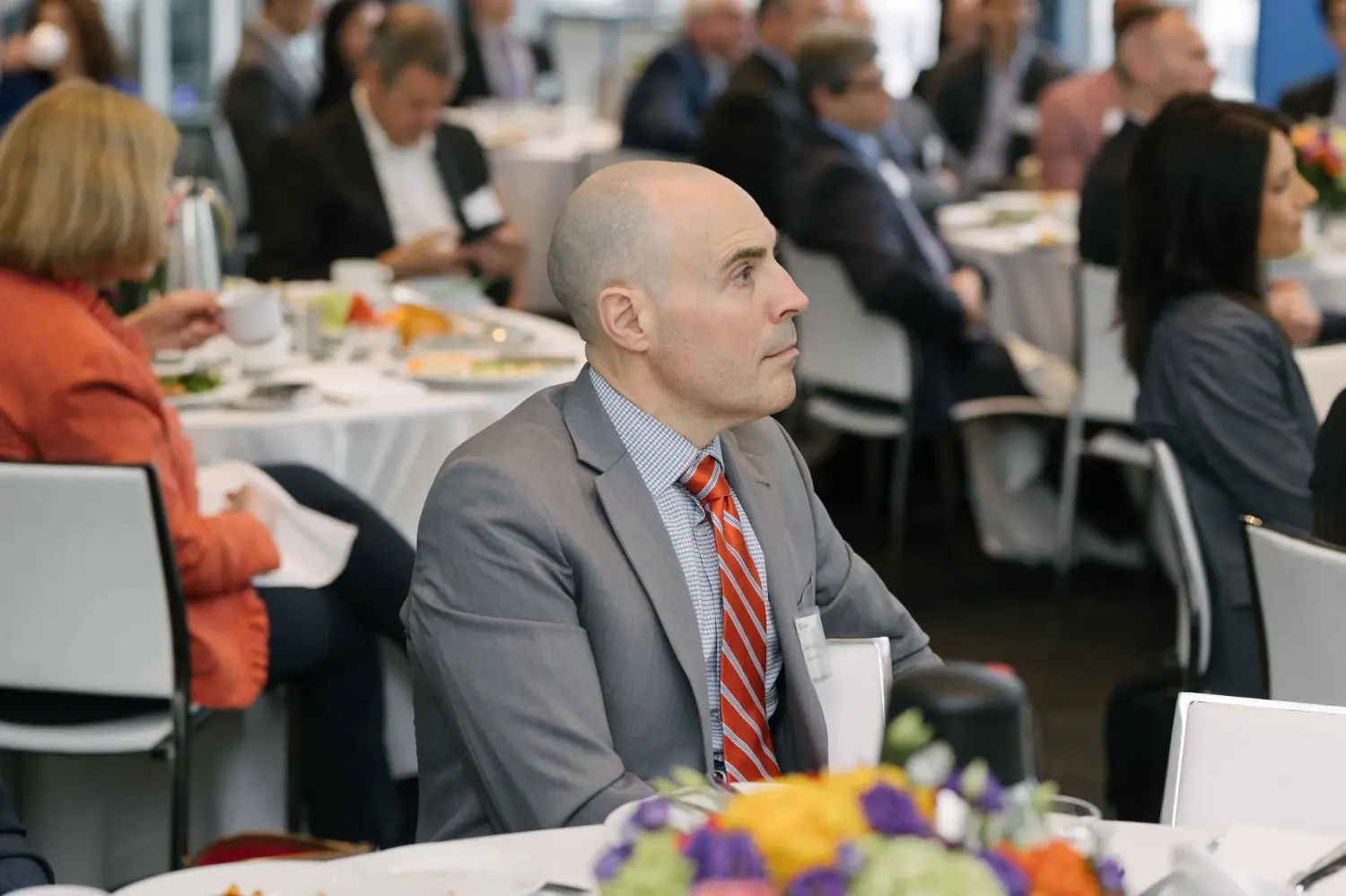 Photo from 37th annual Canadian Insurance Outlook Breakfast: man watching.