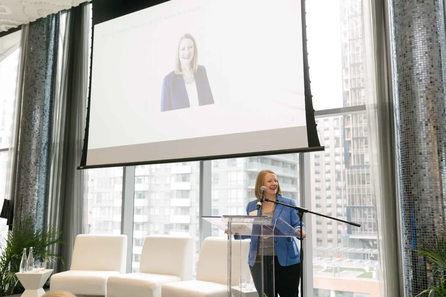 Photo from 37th annual Canadian Insurance Outlook Breakfast: Monica is presenting.