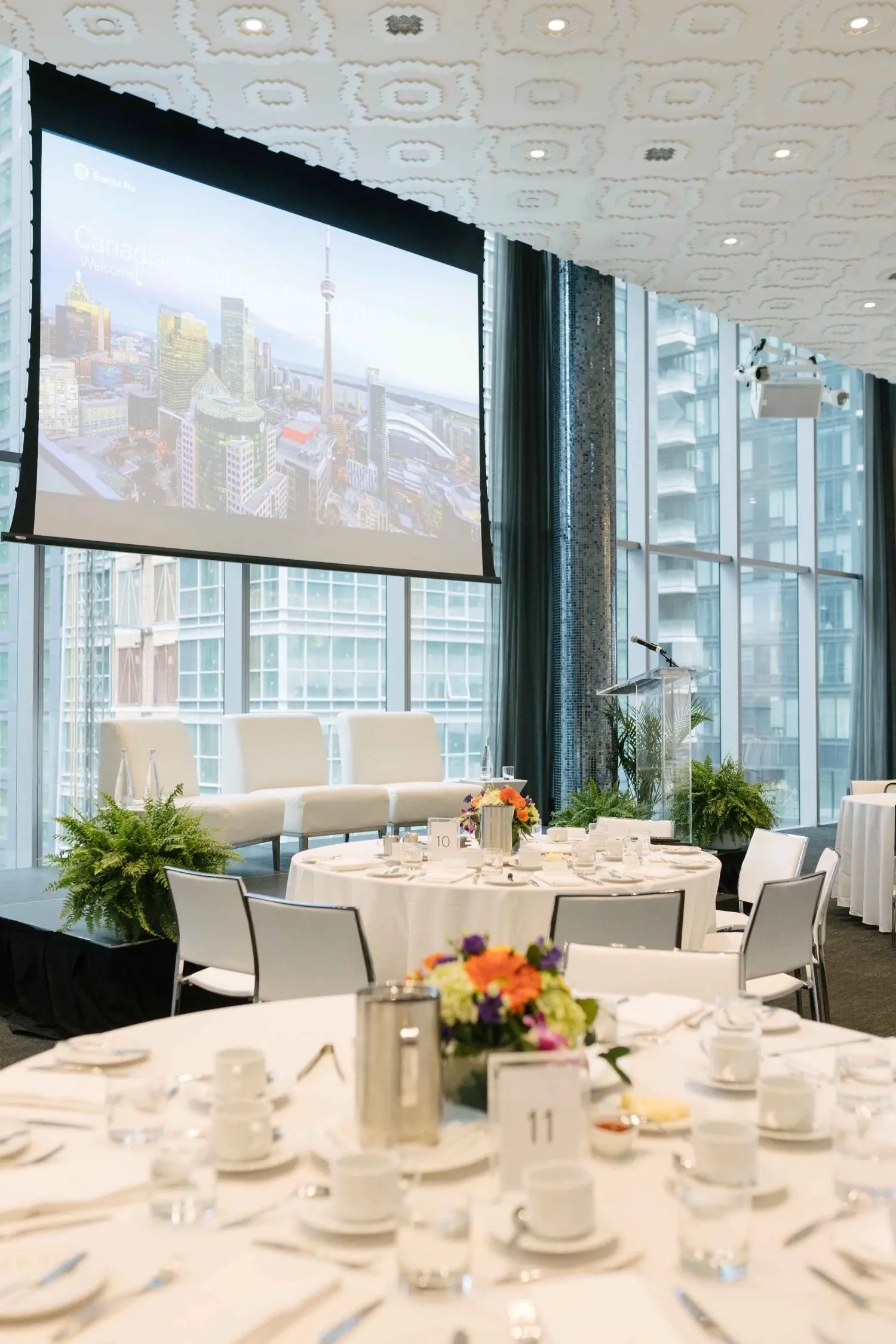 Photo from 37th annual Canadian Insurance Outlook Breakfast: white table background.