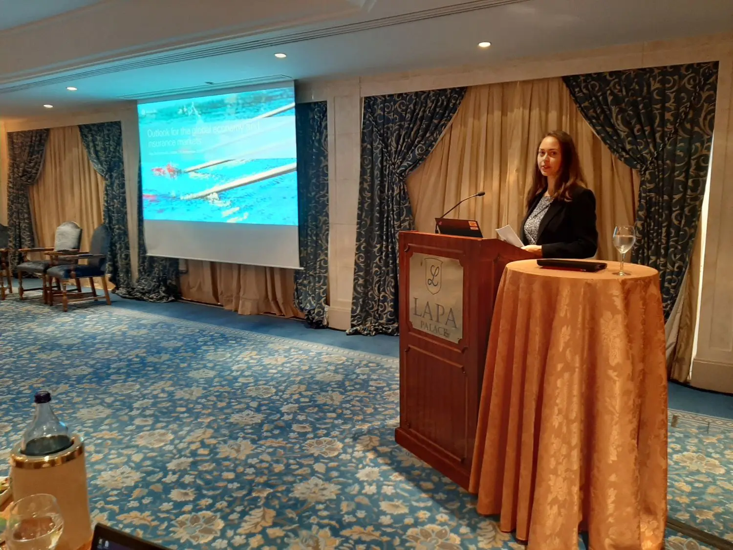 speaker presenting on a conference